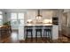 Bright kitchen featuring a large island, stainless appliances, white cabinetry, and many windows at 136 Morgans Branch Rd, Belmont, NC 28012