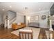 Bright living room with a fireplace, warm wood floors, and two couches under recessed lighting at 136 Morgans Branch Rd, Belmont, NC 28012