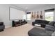 Spacious living room with movie screen, comfortable seating, and natural light, great for entertainment at 136 Morgans Branch Rd, Belmont, NC 28012