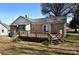 Backyard featuring a wood deck and brick house with exterior French doors at 1460 Legion Club Rd, Salisbury, NC 28146