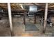 Unfinished basement featuring exposed support beams, concrete floor, and cinder block walls at 1460 Legion Club Rd, Salisbury, NC 28146