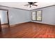 Bedroom with hardwood floors, two windows, French doors and wood trim at 1460 Legion Club Rd, Salisbury, NC 28146