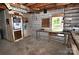 Well-lit garage with windows, workbench, shelving, and tools for various projects at 1460 Legion Club Rd, Salisbury, NC 28146