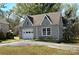 Charming detached garage with gable roof, stone exterior, and single-car garage door at 1460 Legion Club Rd, Salisbury, NC 28146