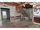 Spacious cinderblock garage showcasing a workbench, stairs, and ample storage options at 1460 Legion Club Rd, Salisbury, NC 28146