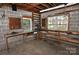 Functional garage featuring workbench, natural light, and storage, perfect for DIY projects at 1460 Legion Club Rd, Salisbury, NC 28146