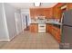 Traditional-style kitchen featuring wood cabinets, tile backsplash, and modern appliances at 1460 Legion Club Rd, Salisbury, NC 28146