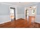 Bright living room with hardwood floors and white trim throughout the home at 1460 Legion Club Rd, Salisbury, NC 28146