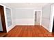 Spacious living room featuring hardwood floors and custom built-in shelving at 1460 Legion Club Rd, Salisbury, NC 28146