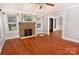 Spacious living room with hardwood floors and a brick fireplace at 1460 Legion Club Rd, Salisbury, NC 28146
