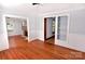 Spacious living room featuring hardwood floors, fireplace and custom built-in shelving at 1460 Legion Club Rd, Salisbury, NC 28146