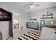 Bedroom with gray walls, neutral carpet, dresser and a view into another room at 14921 Baldridge Dr, Huntersville, NC 28078