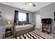 Comfortable bedroom featuring a daybed, ceiling fan, and natural light from the window at 14921 Baldridge Dr, Huntersville, NC 28078
