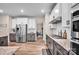 Spacious kitchen with stainless steel appliances, granite countertops, and ample cabinet storage at 14921 Baldridge Dr, Huntersville, NC 28078