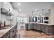 Kitchen featuring a large island, stainless appliances, tile backsplash, and an open-concept layout at 14921 Baldridge Dr, Huntersville, NC 28078