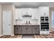 Well-equipped kitchen with stainless appliances, granite countertops, and white and gray cabinets at 14921 Baldridge Dr, Huntersville, NC 28078