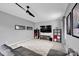 Relaxing living room with a modern ceiling fan, large screen TV, and area rug at 14921 Baldridge Dr, Huntersville, NC 28078