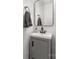 Bathroom with stylish fixtures, gray vanity, and decorative mirror, creating a welcoming space at 1527 Meadow Glen Ln, Rock Hill, SC 29730