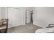 Bedroom featuring three white closets, neutral carpet, and an open door leading to a bright room at 1527 Meadow Glen Ln, Rock Hill, SC 29730