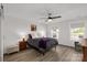 Bright bedroom featuring a ceiling fan, two windows, and wood-look flooring at 1527 Meadow Glen Ln, Rock Hill, SC 29730