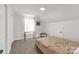Bedroom featuring neutral carpet, a double bed, and minimalist decor at 1527 Meadow Glen Ln, Rock Hill, SC 29730