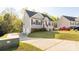 Inviting home with a two-car garage, extended driveway, manicured lawn, and a welcoming front entrance at 1527 Meadow Glen Ln, Rock Hill, SC 29730