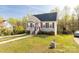 Well-maintained home with an inviting walkway, green lawn, and vibrant trees offering a peaceful setting at 1527 Meadow Glen Ln, Rock Hill, SC 29730