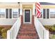 Inviting front entrance featuring brick steps, crisp white railings, and a charming front door with sidelights at 1527 Meadow Glen Ln, Rock Hill, SC 29730