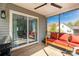 Inviting screened-in porch with comfortable red seating and view of backyard at 1527 Meadow Glen Ln, Rock Hill, SC 29730