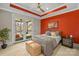 Bedroom showcasing an accent wall, a modern bed, and a balcony access at 1754 Brawley School Rd, Mooresville, NC 28117
