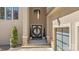 Inviting entrance with double doors, stone accents, and manicured shrubs at 1754 Brawley School Rd, Mooresville, NC 28117