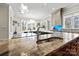 Close-up of a kitchen island featuring a sink and a granite countertop at 1754 Brawley School Rd, Mooresville, NC 28117