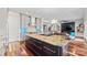 Kitchen features a large island, stainless steel appliances, and opens to living spaces at 1754 Brawley School Rd, Mooresville, NC 28117