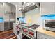 State-of-the-art kitchen with stainless steel appliances and custom cabinetry at 1754 Brawley School Rd, Mooresville, NC 28117