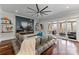 Living room has an electric fireplace, large sofa, and access to an outdoor patio at 1754 Brawley School Rd, Mooresville, NC 28117