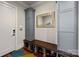 Well-organized mudroom with ample storage, a bench, and stylish cabinets at 1754 Brawley School Rd, Mooresville, NC 28117