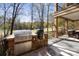 Outdoor kitchen with built-in grill and brick accents, offering a perfect space for cooking at 1754 Brawley School Rd, Mooresville, NC 28117