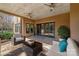 Inviting outdoor patio with comfortable seating, ceiling fans, and a view of the yard at 1754 Brawley School Rd, Mooresville, NC 28117