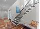 Elegant staircase features hardwood floors, stylish railings, and plenty of natural light at 1754 Brawley School Rd, Mooresville, NC 28117
