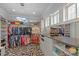Spacious walk-in closet with custom shelving, drawers, and a stylish carpet at 1754 Brawley School Rd, Mooresville, NC 28117