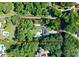 Expansive property featuring a home with a private pool and surrounded by lush greenery at 200 Highland Forest Dr, Charlotte, NC 28270