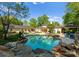 Inviting backyard with a large pool, spa, outdoor seating areas, and lush landscaping at 200 Highland Forest Dr, Charlotte, NC 28270