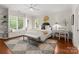 Bright bedroom with a window seat, a large window, and a neutral color scheme that creates a calming and inviting atmosphere at 200 Highland Forest Dr, Charlotte, NC 28270