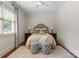 Serene bedroom featuring a plush bed, coordinating bedside tables and lamps, complemented by stylish patterned ottomans at 200 Highland Forest Dr, Charlotte, NC 28270