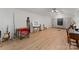 Spacious bonus room with light-colored flooring, golf net, and ample space for recreational activities at 200 Highland Forest Dr, Charlotte, NC 28270