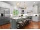 Bright kitchen with a large island, stainless steel appliances, and stylish pendant lighting at 200 Highland Forest Dr, Charlotte, NC 28270