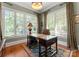 Elegant office featuring a large window with natural light, hardwood floors and stylish decor at 200 Highland Forest Dr, Charlotte, NC 28270