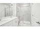 Modern bathroom featuring dual sink vanity with shower and tile surround at 2060 Old Rivers Rd, Concord, NC 28027