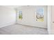 Spacious bedroom featuring neutral walls, carpet, and large windows for natural light at 2060 Old Rivers Rd, Concord, NC 28027