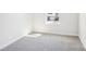 Cozy bedroom with neutral carpet and a window for natural light at 2060 Old Rivers Rd, Concord, NC 28027
